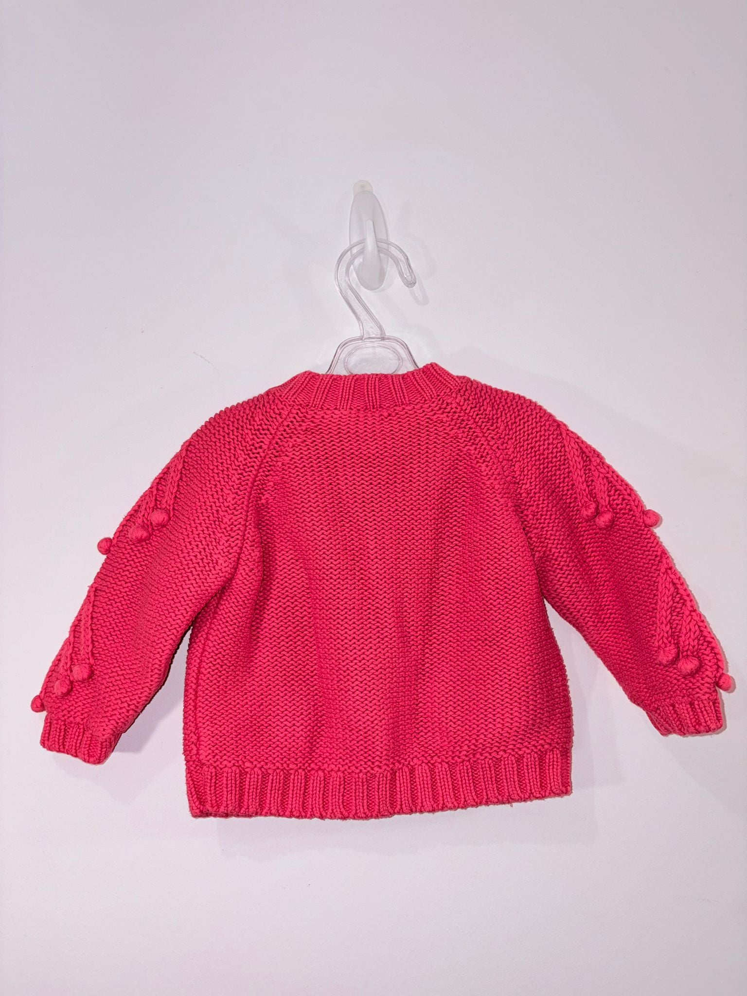 Cardigan avec des petits pompons
