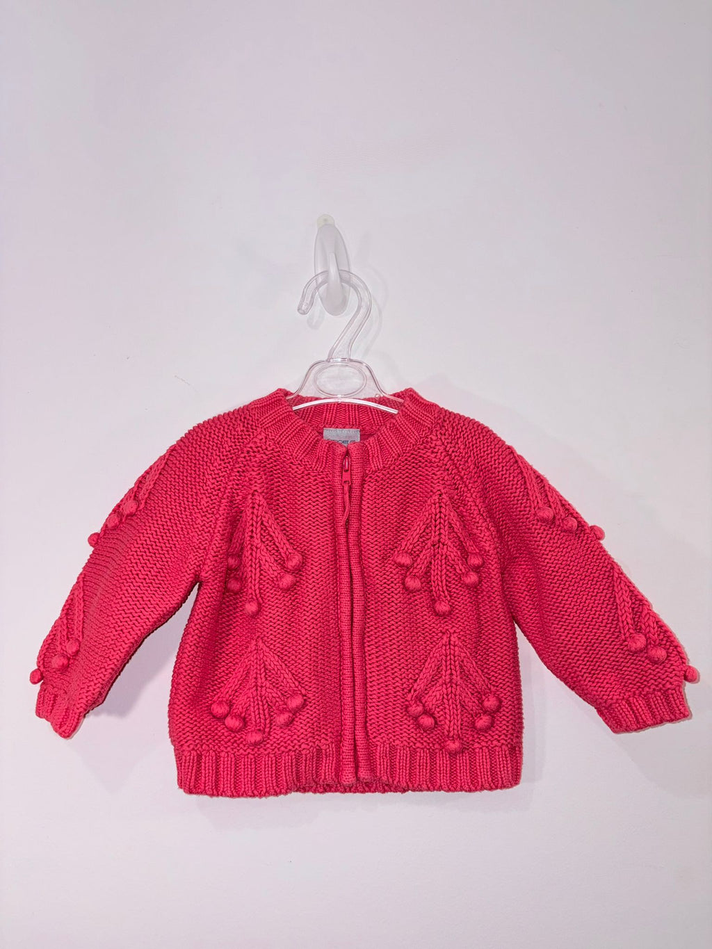 Cardigan avec des petits pompons