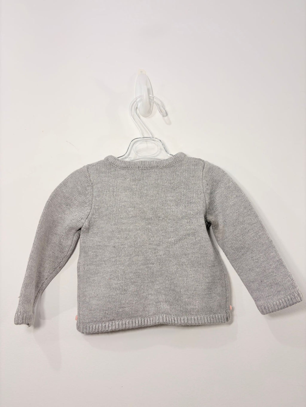 Gilet avec des petits pompons