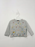 Gilet avec des petits pompons